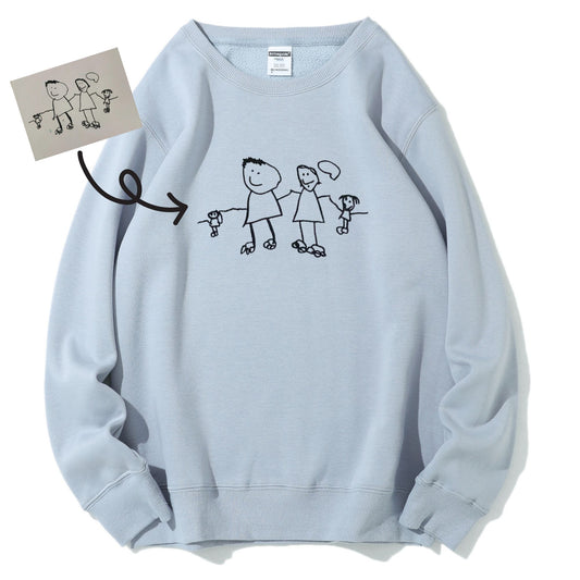 Custom embroidered sweatshirt featuring child’s drawing stitched 